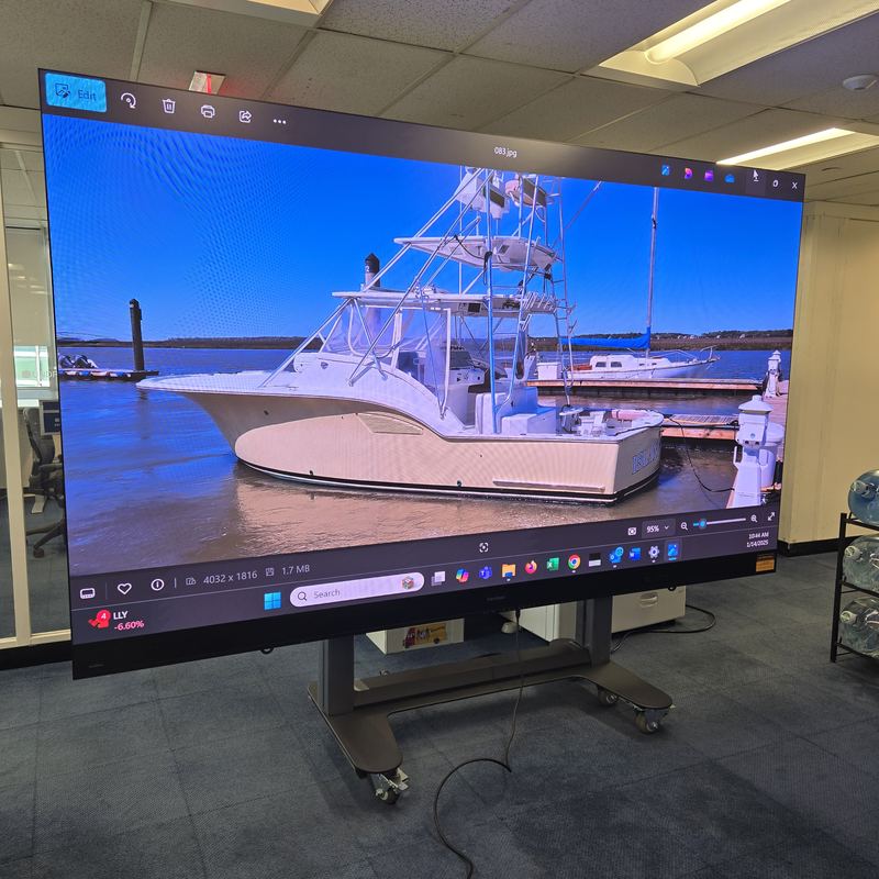 Large-format on rolling stand — Oversized panel on a mobile base for rooms that need to reconfigure between events.