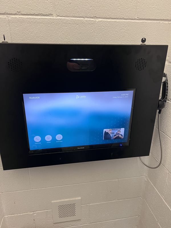 Hardened steel enclosure — Fabricated enclosure housing the display, camera, speakers and handset — serviceable from the front.